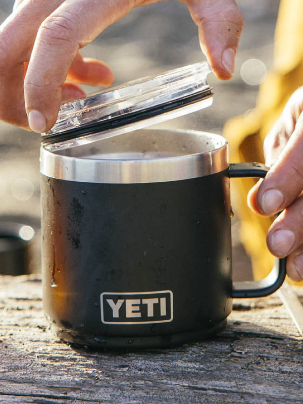 Black YETI mug with a lid on a wooden surface